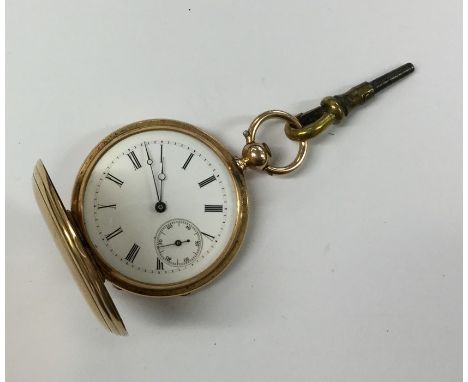 A lady's engine turned 18 carat fob watch. Approx. 41 grams. Est. £150 - £200.
