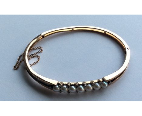 A natural pearl and rose diamond hinged bracelet with concealed clasp. Approx. 11.5 grams. Est. £450 - £500.