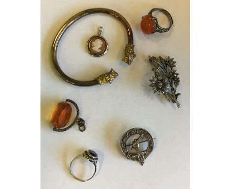 A silver gilt torque bangle, brooch etc. Approx. 45 grams. Est. £25 - £35.