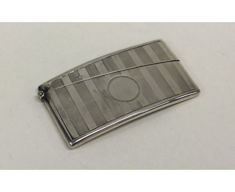 A silver engine turned card case with hinged top. Birmingham. Approx. 40 grams. Est. £20 - £30.