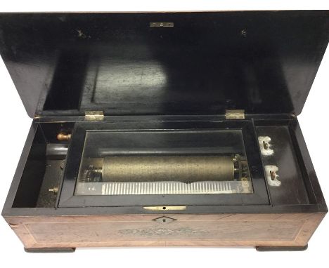 A rosewood mounted and inlaid musical box on bracket feet. Est. £100 - £150.