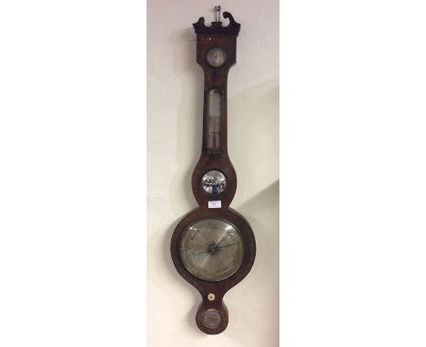 A mahogany banjo barometer with inlaid decoration. Est. £60 - £80.
