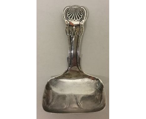 A silver honeysuckle pattern caddy spoon with square bowl. Birmingham. By JW. Approx. 11 grams. Est. £40 - £60.
