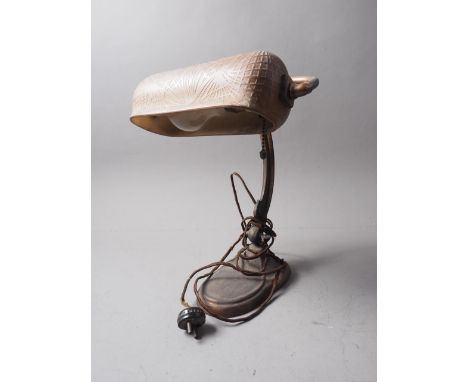 An Art Nouveau style copper desk lamp with etched brown glass shade 