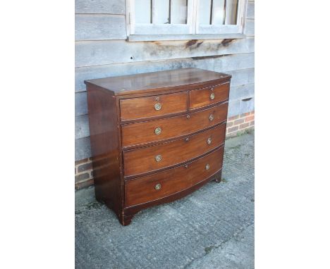 A Georgian mahogany bowfront chest of two short and three long graduated drawers with brass ring handles, on bracket feet, 40