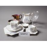 A Continental Art Deco style part combination service with floral decoration, glass flutes and