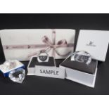 A collection of Swarovski Collectors Club issue, plaques, key fobs, Christmas decorations, etc,