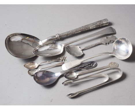 A white metal serving spoon, a Georgian silver tablespoon, a silver ladle, two pairs of silver sugar tongs, two spoons, stamp