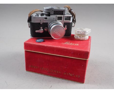 A Leica M3&nbsp;camera number&nbsp;837 828&nbsp; with Summicron f=5cm 1.2 lens, light meter and two filters, in box 