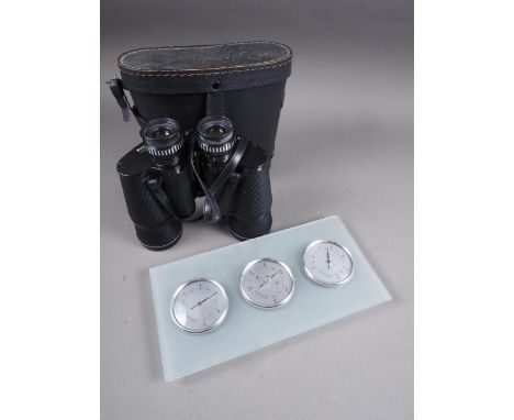 A pair of 10x50 binoculars, in case, and a wall mounted aneroid barometer, thermometer and hygrometer 