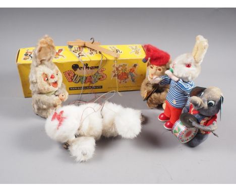 A Pelham puppet "Poodle", four wind-up mechanical toys, and a rise-and-fall light with glass shade 