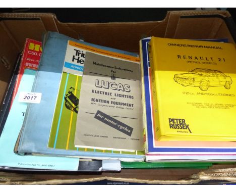 A box of car and motorcycle instruction manuals to include: BMW R Series, MGB Tourer and GT Drivers Handbook, etc.