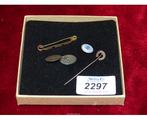An unmarked gold Tie Pin and a lapel pin, one silver cufflink and a silver backed engine turned enamel button.