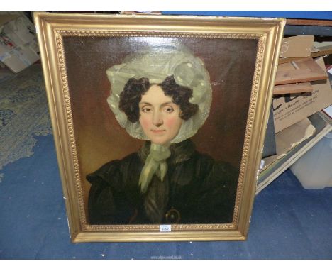An early Victorian Oil on canvas portrait of a lady in a gilt frame, no visible signature, 23 1/2 x 28".