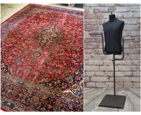 KASHAN-STYLE CARPET, with central medallion suspending pendants, on a red field of scrolling foliage, navy blue spandrels, pa