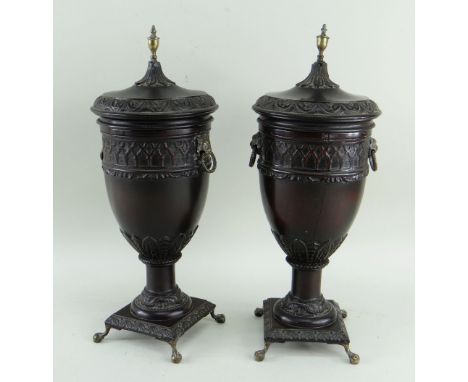 PAIR GEORGIAN-STYLE TURNED WOOD URNS &amp; COVERS, foliate carved borders, brass urn finials, lion's mask loose ring handles,