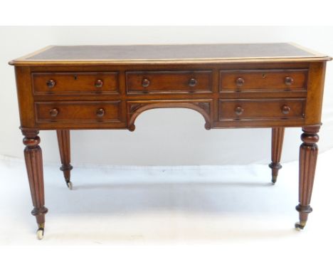 GOOD EARLY VICTORIAN WALNUT WRITING TABLE IN THE MANNER OF GILLOWS, inset writing surface above arrangement of five drawers, 