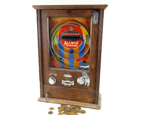 OLIVER WHALES OF REDCAR ALLWIN MINOR PENNY SLOT MACHINE, c. 1950s, six-win game, oak case, with quantity of 1penny coins and 