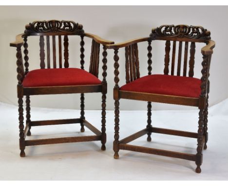 PAIR EARLY 20TH CENTURY OAK ARMCHAIRS, with leaf carved crestings, barley twist/bobbin uprights, and slatted sides (2)