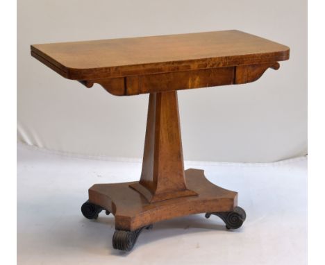 WILLIAM IV BURR ELM FOLDER-OVER CARD TABLE with scrolled frieze, chamfered tapering square section column, concave platform b