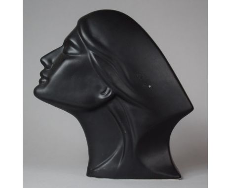 A Black Glazed Ceramic Bust of a Maiden, 21.5cm high 