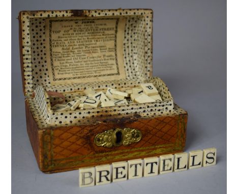 A 19th Century Dome Topped Box in the Form of a Travelling Trunk Containing Bone Alphabetical and Numerical Tiles, Each 1.5cm