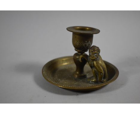 A Small Brass Candlestick with Monkey Mount by Kinco, England, 9cm Diameter 