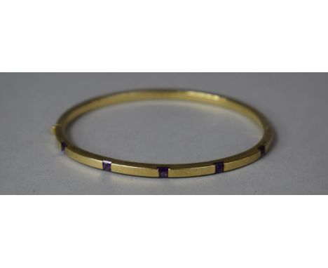 A 9ct Gold and Amethyst Bangle, 7.3g 