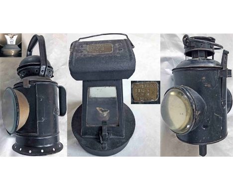 Trio of Great Western Railway LAMPS comprising a 3-aspect handlamp, stamped GWR, with reservoir and burner marked GWR, a sign