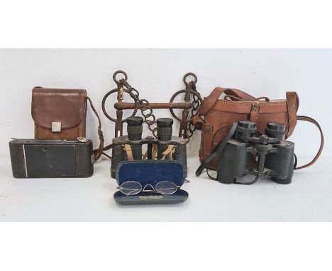 'Anslo' folding camera in brown leather case, a pair of Prinz 8x30 binoculars in brown leather case, another pair of binocula