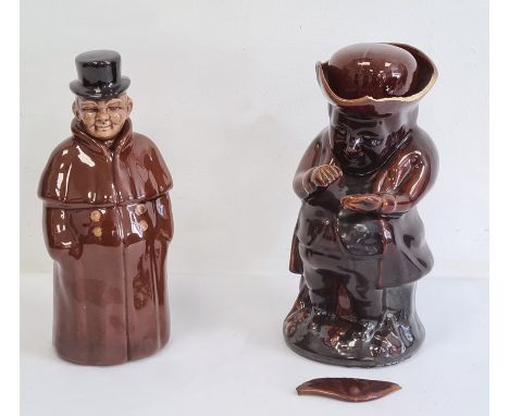 Treacle glazed Toby jug and a pottery figure decanter, a Chinese soapstone miniature model of a monkey, its paws together kne