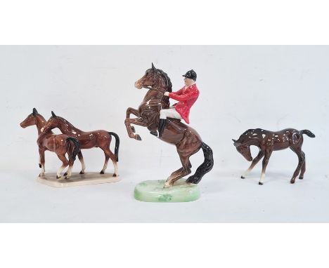 Beswick pottery glazed huntsman on horseback and two pottery model horses with brown glaze (3) 