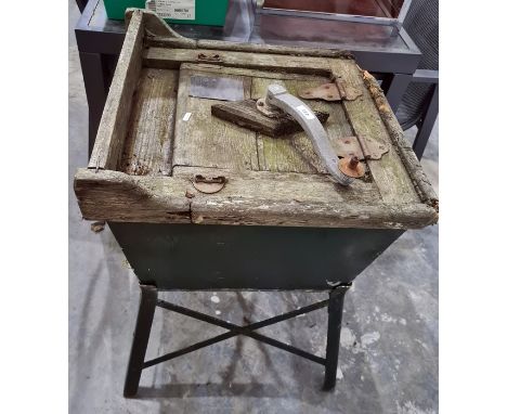 Vintage wooden and tin washing machine labelled 'The Housewives Darling Washer' on metal green painted stand 