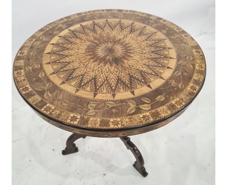 Nineteenth century Italian marquetry and parquetry inlaid centre table, circular, the top with central sunburst within a flor