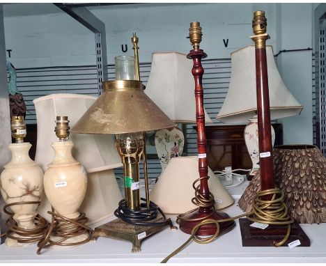 Various table lamps to include two wooden table lamps, brass paraffin lamp converted to electricity with label 'Paris, Orient