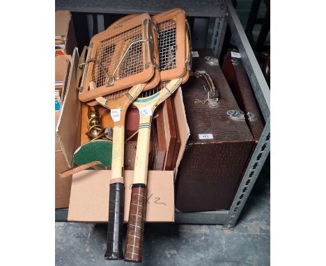 Assorted books, a camera and a cased Singer sewing machine and two vintage tennis rackets 