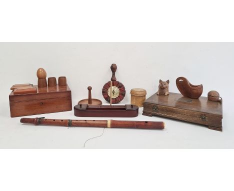 Carved wooden inkwell in the form of a cat with glass eyes, various wooden eggcups, a desk tidy with compartments for stamps,