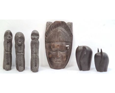 Carved African mask, carved monkeys 'See No Evil, Hear No Evil and Speak No Evil', two carved African elephants, an African c