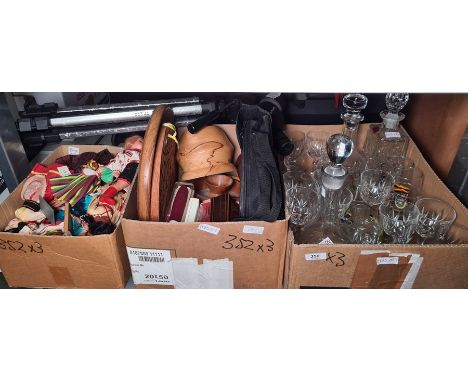 Box of decanters and wine glasses, a box of assorted collectables, a box of dolls of the world and a camera tripod 