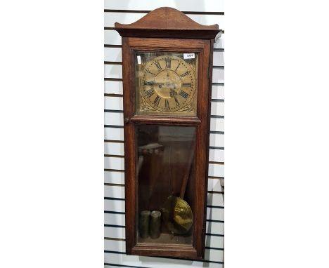 20th century rectangular weight-driven wall clock with wooden gilt-coloured Roman numeral dial, 90cm long 