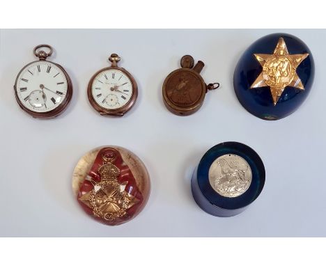 Three acrylic paperweights, each set with a medals; one 1939-45 medal, one 1939-45 star and 1914-15 star, together with,&nbsp