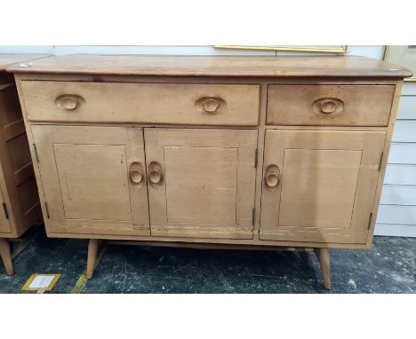 20th century Lucian Ercolani Ercol model 351 sideboard, the elm top above beech body, with panelled doors, carved handles and