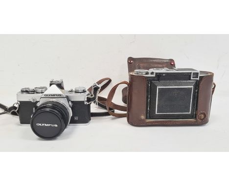 Olympus OM-1 camera and a Zeiss Ikon Super Ikonta in brown leather case (2) Condition ReportOlympus- No obvious scratches to 