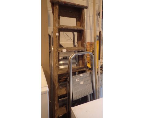 Three pairs of step ladders, one wood and two aluminium
