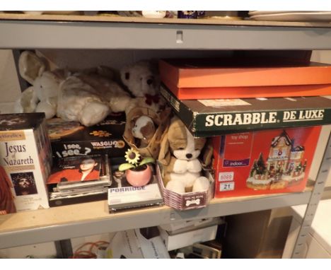 Shelf of toys and games including Monopoly, Roulette, Fibre Optic Toy Shop, Christmas crackers, cards, CDs, cuddly toys etc