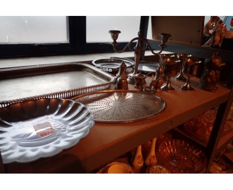 Shelf of various plated items including goblets, candlesticks, plates, condiments etc