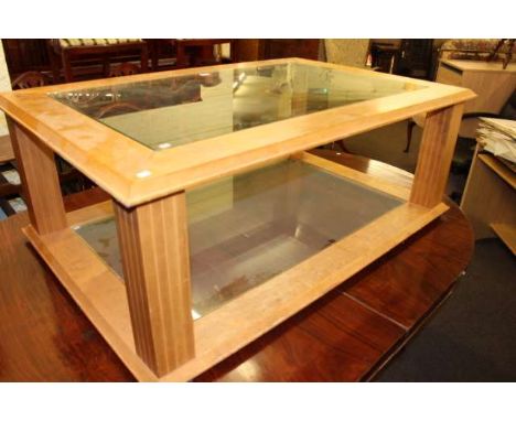 Light wood finish glass topped coffee table with glazed undershelf