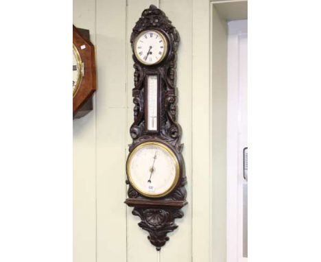 19th century carved barometer with inset drum clock