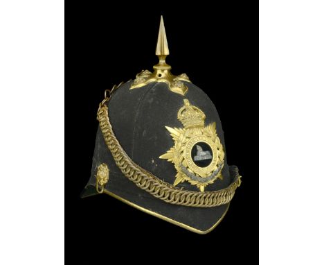 The Lincolnshire Regiment Officer’s Blue Cloth Helmet 1902-14.â€¨The scull complete with gilt metal fittings, the frontal pla