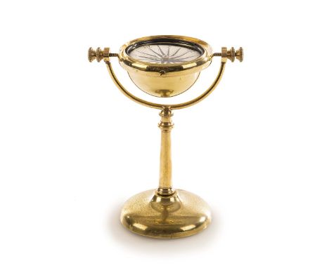 A 19TH-CENTURY LACQUERED BRASS GIMBALLED DRY CARD CONTINENTAL DESK COMPASS, with 2¾in. paper dial stamped Logia within weight